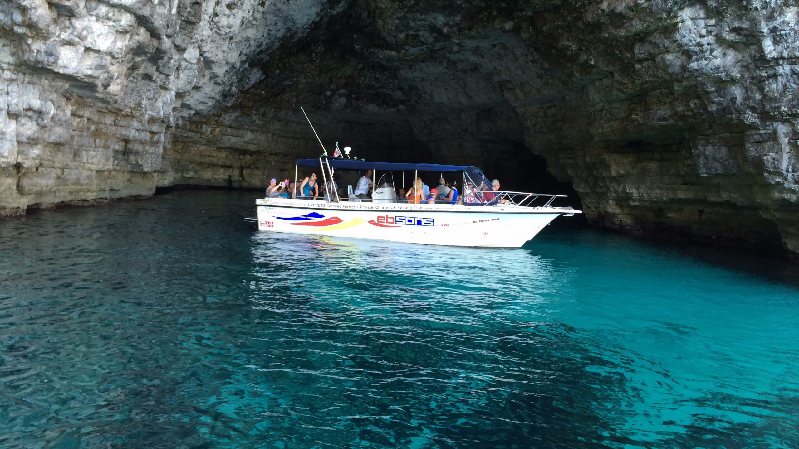 boat under cliff